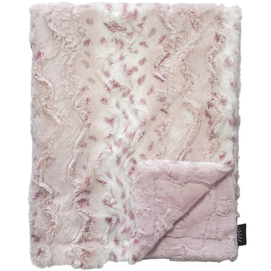Pink textured blanket on a gray background