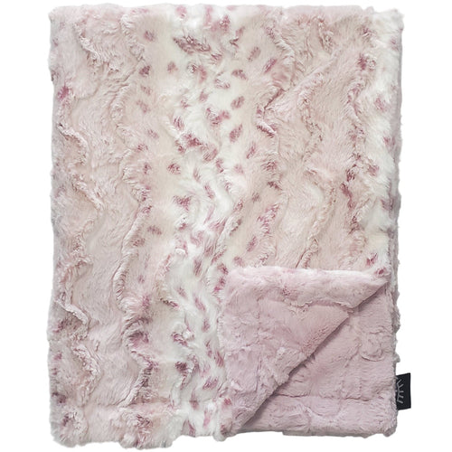 Pink textured blanket on a gray background