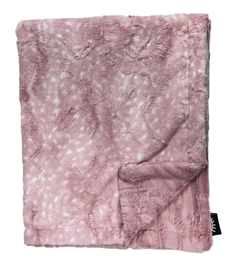 Pink textured blanket on a light gray background